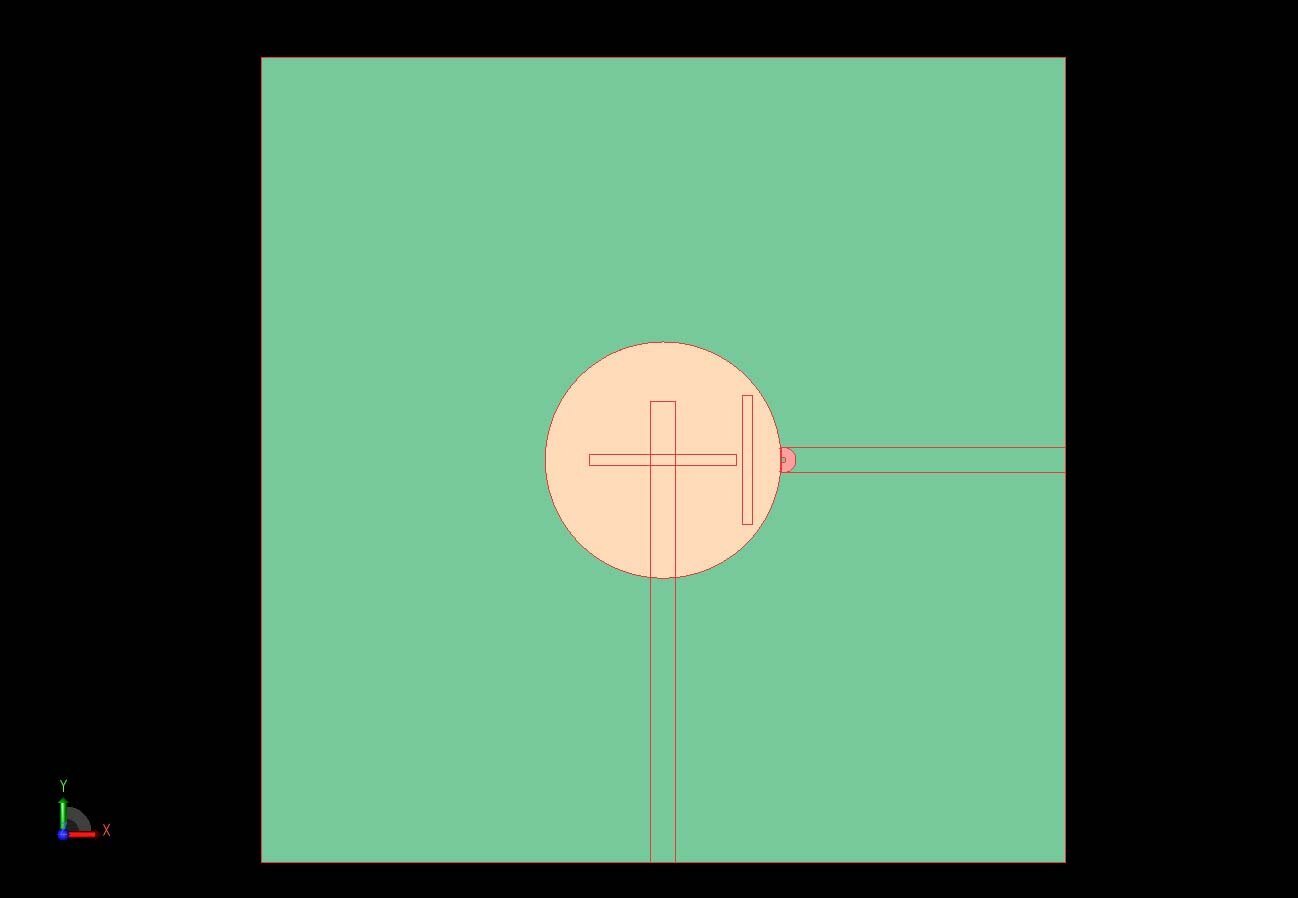 Figure 2:&nbsp; A top view of the dual-band antenna shows the underlying microstrip feeds from the first and second ports and the two slots in the ground plane for coupling the second port into the DRA.