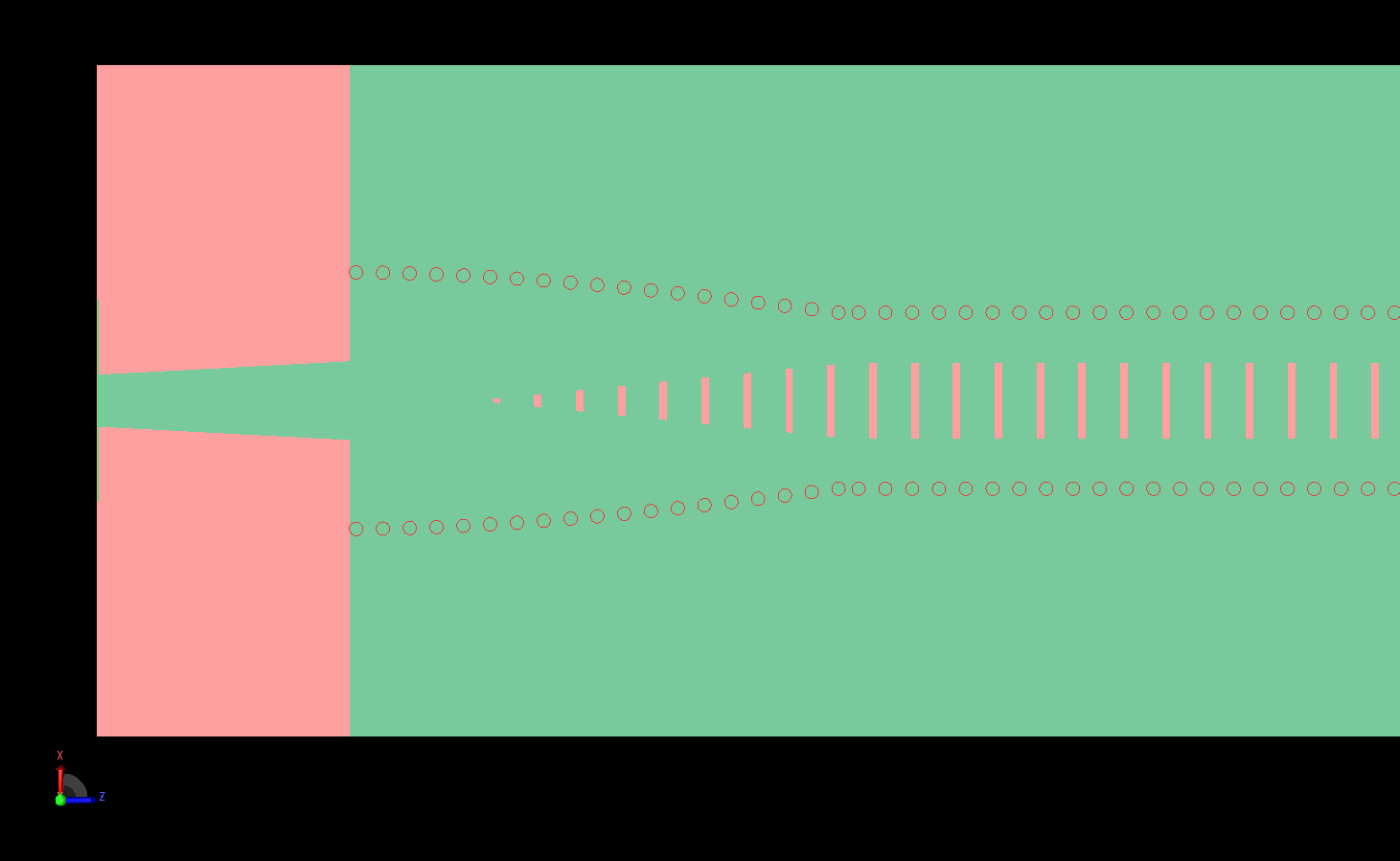 Figure 2: A detailed view of one end of the antenna shows the tapered slots and the curved via path located under the microstrip line.